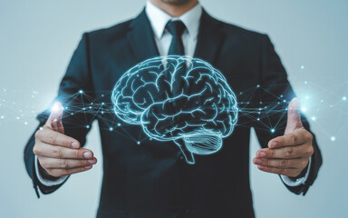 Businessman presenting a digital hologram of a brain representing ideas and innovation in business