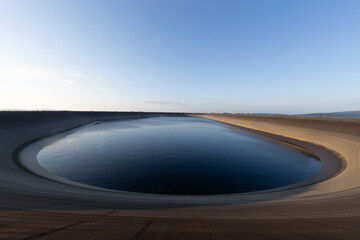 Dlouhe Strane pumped storage dam at sunset in the Jeseniky Mountains. Grid stability. Fighting...