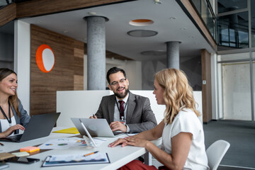 Business people working together on project in modern office