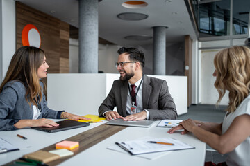 Business team discussing strategy during meeting in modern office