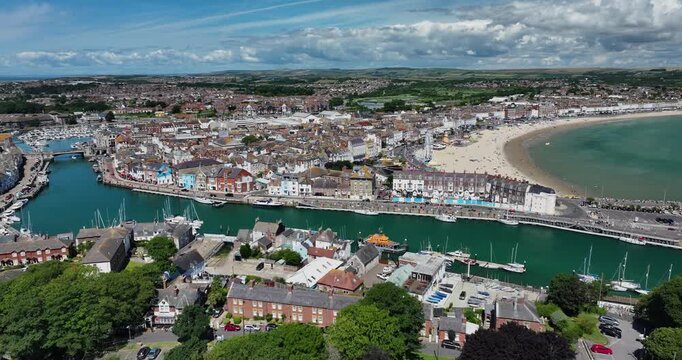 Panning Drone Shot of Weymouth Town, Harbour, Beach Bay and Fort