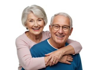 Elderly caucasian woman with grey hair in pink top embracing elderly caucasian man with grey hair in blue sweater and glasses, both smiling broadly on transparent studio background with copy