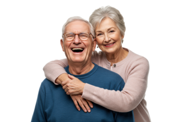 Elderly caucasian man laughing heartily in blue sweater, embraced by elderly woman in pink cardigan, both looking at camera on transparent studio background with copy space, enduring love and family