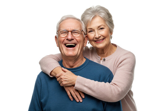 Elderly caucasian man laughing heartily in blue sweater, embraced by elderly woman in pink cardigan, both looking at camera on transparent studio background with copy space, enduring love and family