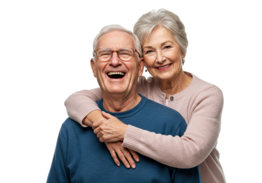 Elderly caucasian man laughing heartily in blue sweater, embraced by elderly woman in pink cardigan, both looking at camera on transparent studio background with copy space, enduring love and family - Powered by Adobe