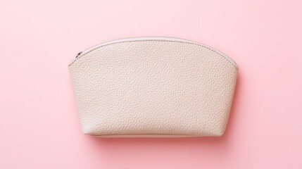 An elegant pink cosmetic bag placed on a soft gradient background, embodying simplicity and style.
