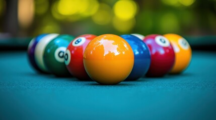 Pool balls in a close-up shot on a teal-green table