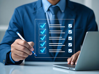Businessman checking off items on a digital list blue suit checklist