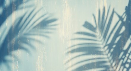 Fototapeta premium Tropical vibe with palm leaf shadows on a vintage blue wall, perfect for summer backgrounds, adding a relaxing and aesthetic atmosphere to your designs.