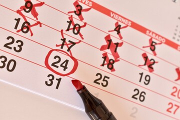 Marked calendar showing past days crossed out and a special date highlighted. Represents waiting...