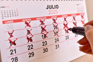 Red crosses on calendar days. Countdown to a special date, anticipation, and time tracking.