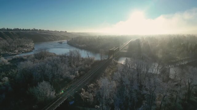 xa drone aerial view over sunrise on a foggy morning is highly atmospheric and cinematic, perfect for stock platforms, Drone Aerial View of Sunrise Over Foggy Landscape &ndash; Peaceful Morning Atmosphere