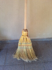 Straw broom also known as rustic broom or witch's broom.