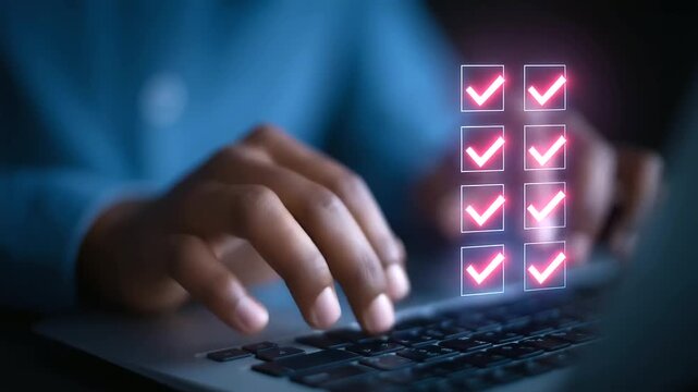 Fingers swiftly type on a laptop keyboard as semi-transparent checkboxes appear onscreen.