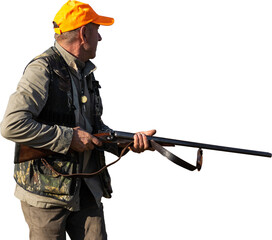 Mature man hunter with gun while walking on field.
