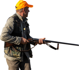 Mature man hunter with gun while walking on field.