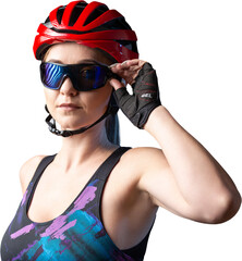A young female cyclist wearing a safety helmet and glasses, dressed in a bib shorts poses against a...