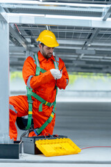 Vertical image of professional technician worker or engineer work with maintenance or check system...