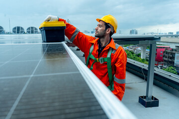 Engineer or technician worker put toolbox on solar cell panel during check or maintenance on...