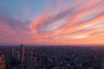 stunning sunset over new york city with skyscrapers silhouetted against vibrant orange and purple hues
