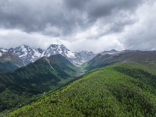Beautiful aerial view of U-shaped valley landscape in Baima Snow Mountain