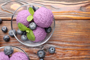 Tasty sorbet with blueberries and mint served on wooden table, flat lay. Space for text