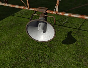 Vintage Rusty Speaker on Metal Framework in Overgrown Grass under Bright Sunlight