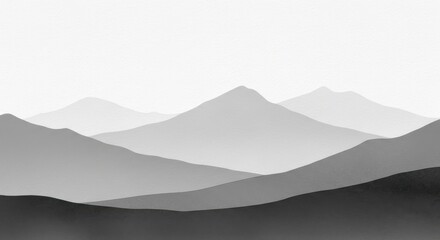 A grayscale mountain range shrouded in fog