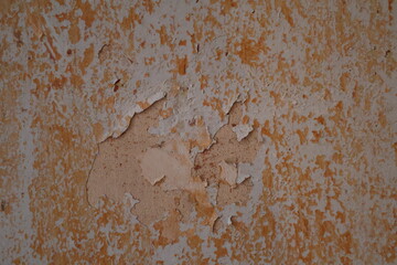 an old wall with peeling paint, rusty metal background