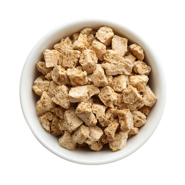 Textured Soy Protein in a Bowl: An overhead shot of textured soy protein chunks fills a white bowl, ideal for highlighting the natural texture and versatile nature of the meat substitute.
