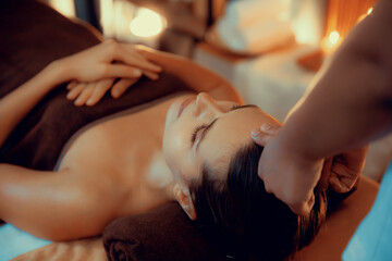 Caucasian woman enjoying relaxing anti-stress head massage and pampering facial beauty skin...