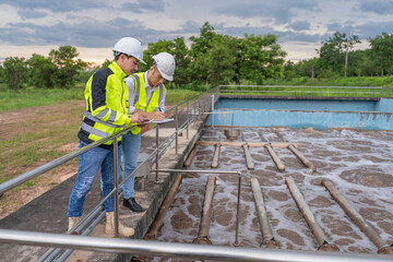 Environmental engineers work at wastewater treatment plants,Water supply engineering working at...