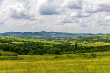 Fototapeta premium Landscape from a hilly area in Transylvania, Eastern Europe in summer