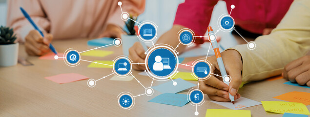 A vibrant office scene capturing teamwork and collaboration with sticky notes and digital tools....