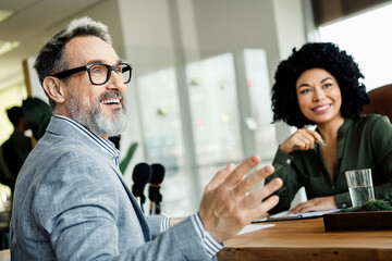 Professional colleagues in a modern office collaborating with enthusiasm and confidence during a...