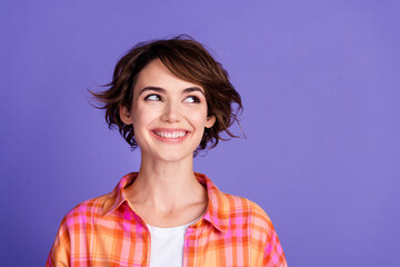 Portrait of nice young lady look empty space wear shirt isolated on purple color background