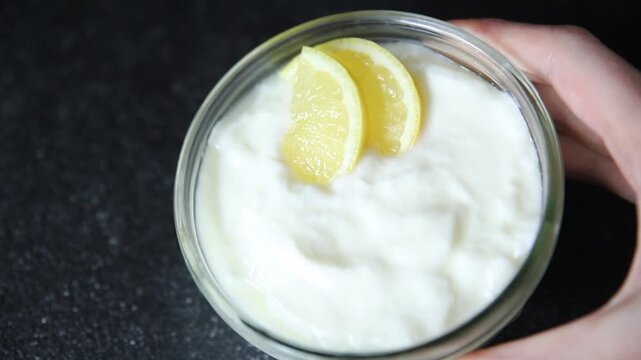 Lemon yogurt natural product skyr sour milk skir fresh delicious gourmet food background on the table rustic food top view copy space keto and paleo diet vegetarian food