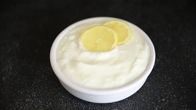 Lemon yogurt natural product skyr sour milk skir fresh delicious gourmet food background on the table rustic food top view copy space keto and paleo diet vegetarian food