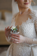 Elegance of a bride in a shimmering wedding gown holding a delicate bouquet