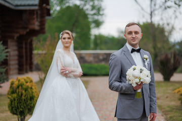 Couple celebrates wedding in outdoor venue surrounded by nature