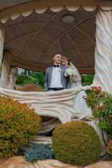 Couple celebrating love in a beautifully designed gazebo surrounded by greenery