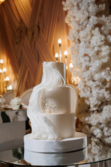 Elegant wedding cake with delicate decoration in a grand event venue