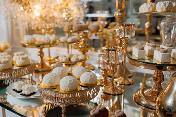 Elegant dessert display featuring assorted sweets at a refined event setting in the evening