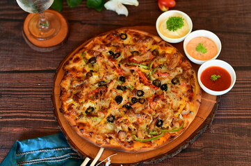 Beef Pizza. Mouthwatering Beef Pizza with Melted Cheese and Spices on Wooden Table