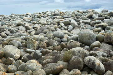 breakwater of the port formed by rocks rounded by erosion