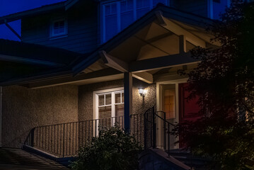Entrance of luxury house with nice spring blossom landscape at night in Vancouver, Canada, North...