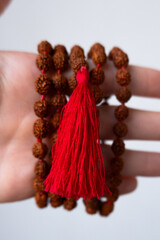  Japamala on the hand. Prayer beads. Religious equipment