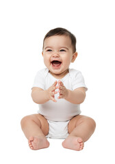 A joyful, adorable infant (6-12 months) with short dark hair and bright expressive eyes, in a white onesie, seated cross-legged on a transparent studio background with copy space, mid-clap, laughing