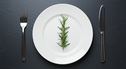 A simple rimless white plate with a single fresh sprig of rosemary placed in the center