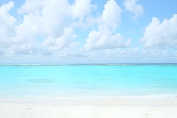 Obraz premium Serene turquoise ocean view with white sand beach and fluffy clouds perfect for summer vacation